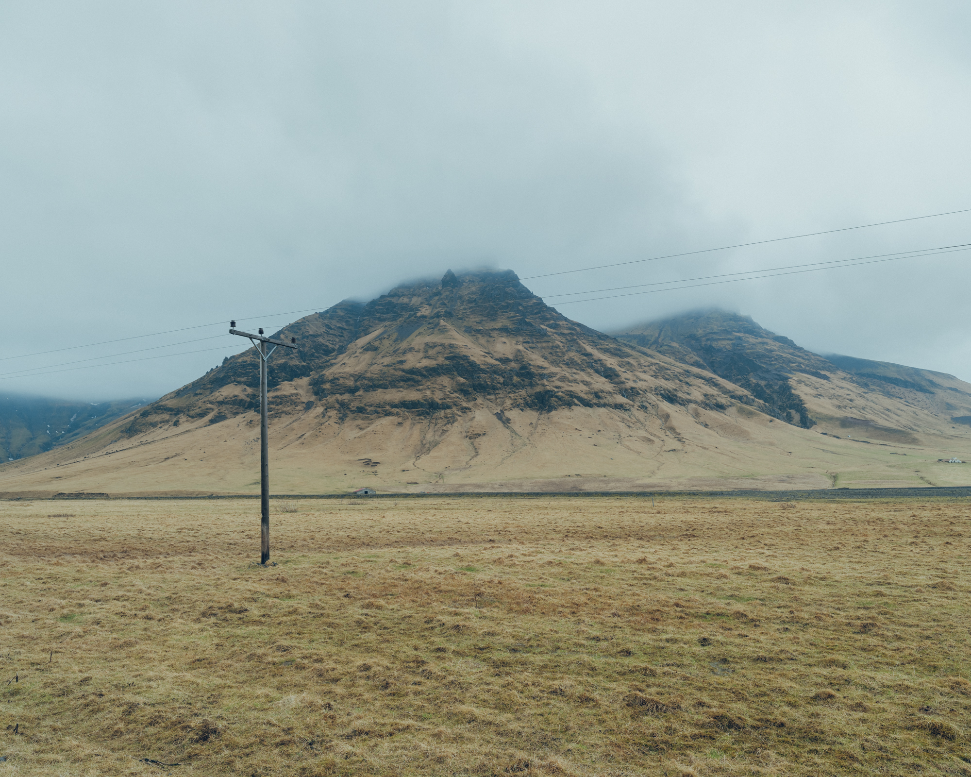 Isolated Electric Pole in Icelandic Wilderness: Symbol of connectivity amidst vast solitude