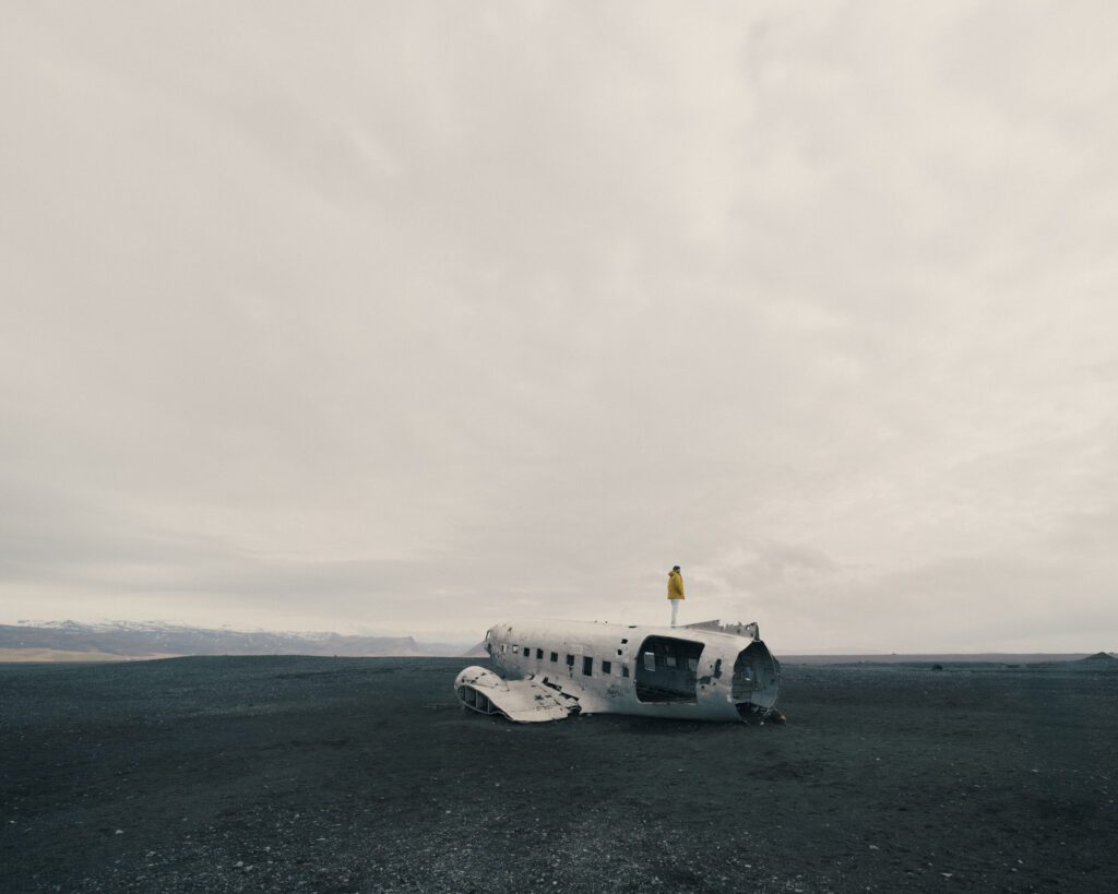 Abandoned DC-3 plane wreck on black sand beach in Iceland"