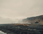 Reynisfjara Beach, a must-visit destination on Iceland’s southern coast, captivates visitors with its iconic black sand and breathtaking rock formations. Located near the picturesque village of Vík, this extraordinary beach is famous for its dramatic basalt columns and the Reynisdrangar sea stacks, towering rock formations that rise majestically from the Atlantic Ocean. These natural wonders are steeped in Icelandic folklore, adding a layer of mystique to their already striking appearance.