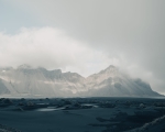 near the Stokksnes Peninsula in Southeast Iceland. The mountain’s distinctive peaks and dark sands make it a famous landscape location for photographers., Vestrahorn Mountain